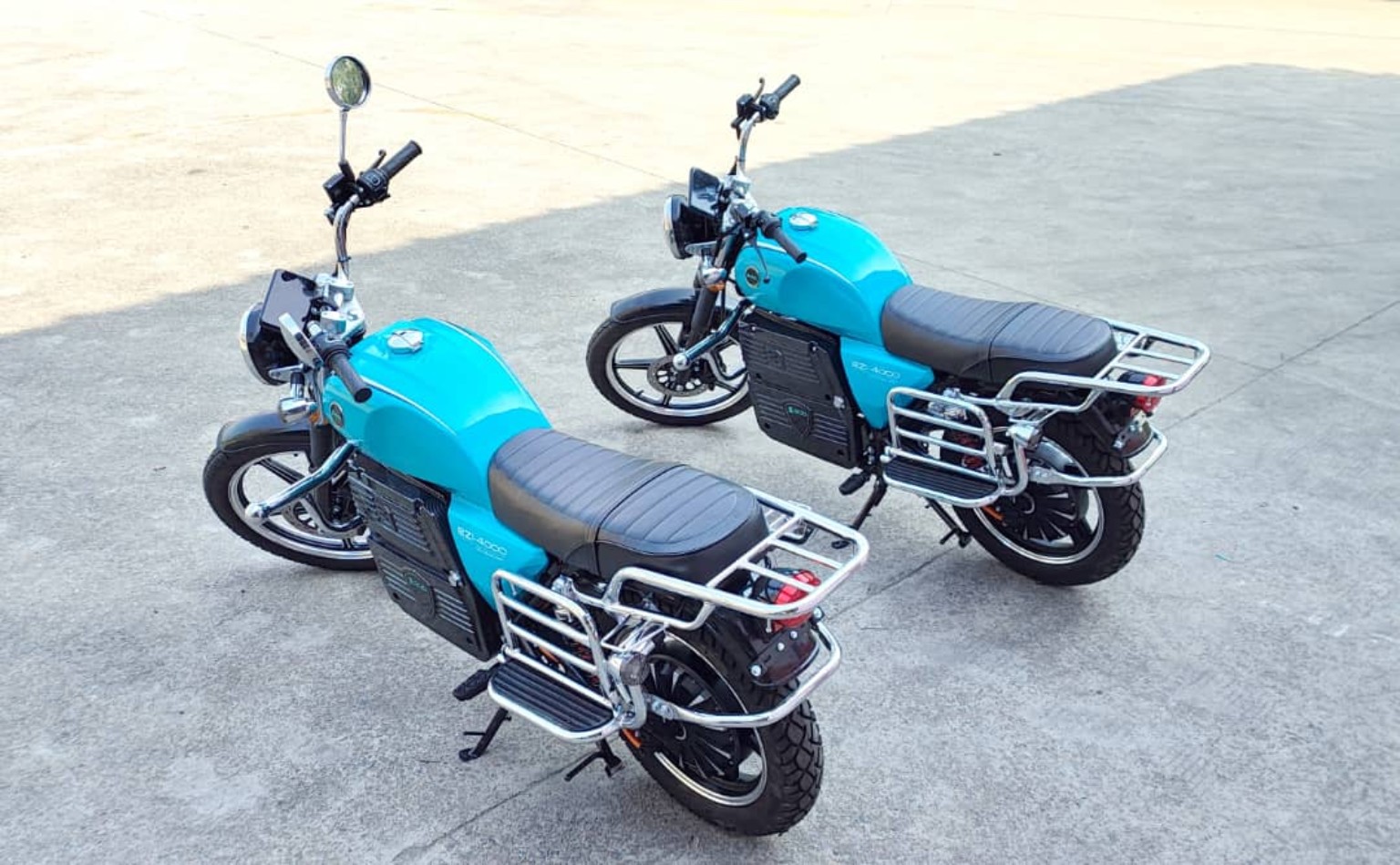 Two EZI electric motorcycles viewed from above